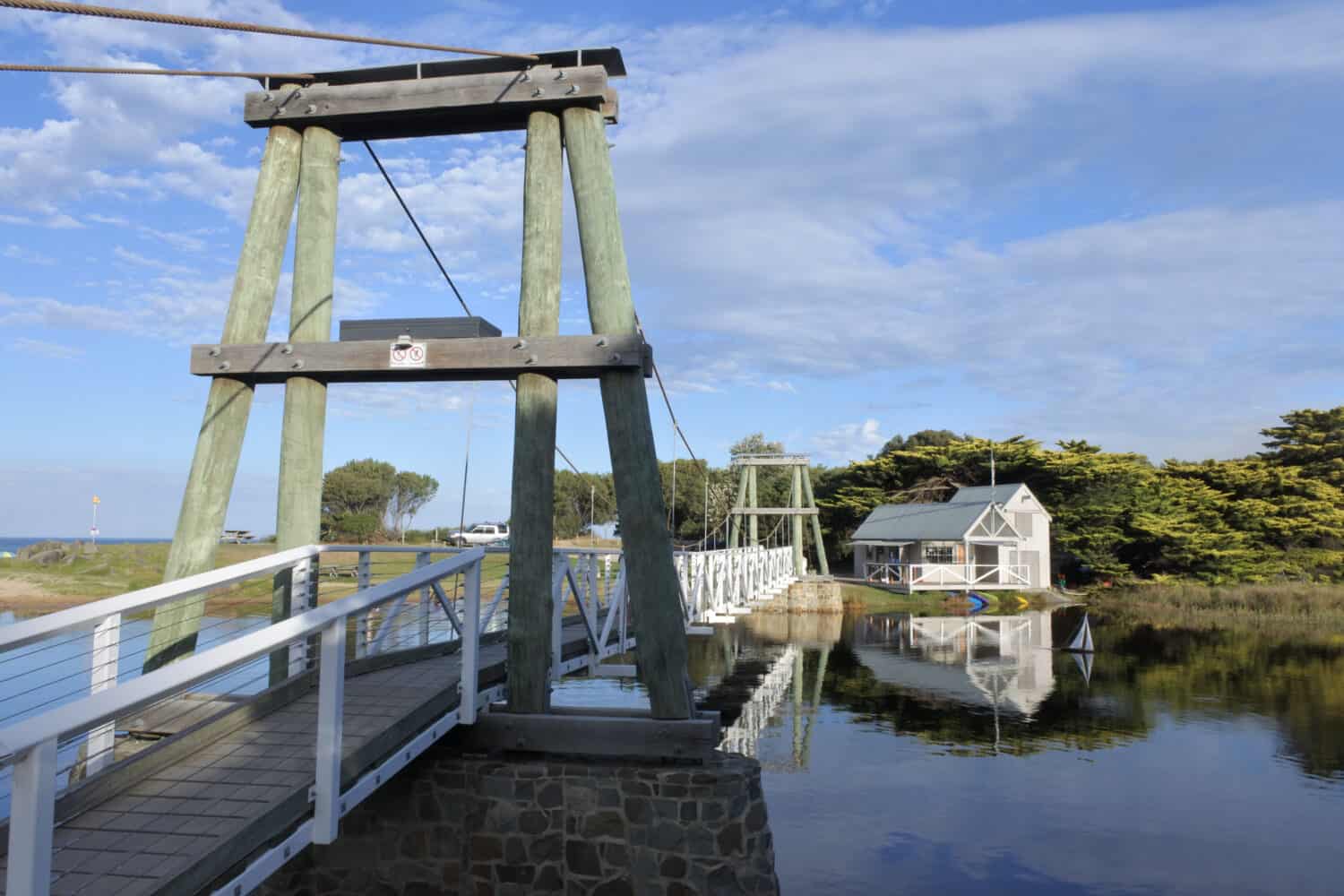 Swing bridge and boathouse in Lorne, Victoria, Australia