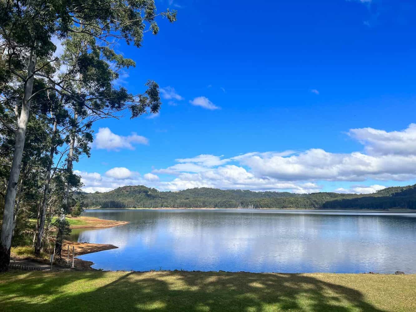 Lake Baroon on a sunny day and reflections in the water, Sunshine Coast Hinterland, Queensland, Australia