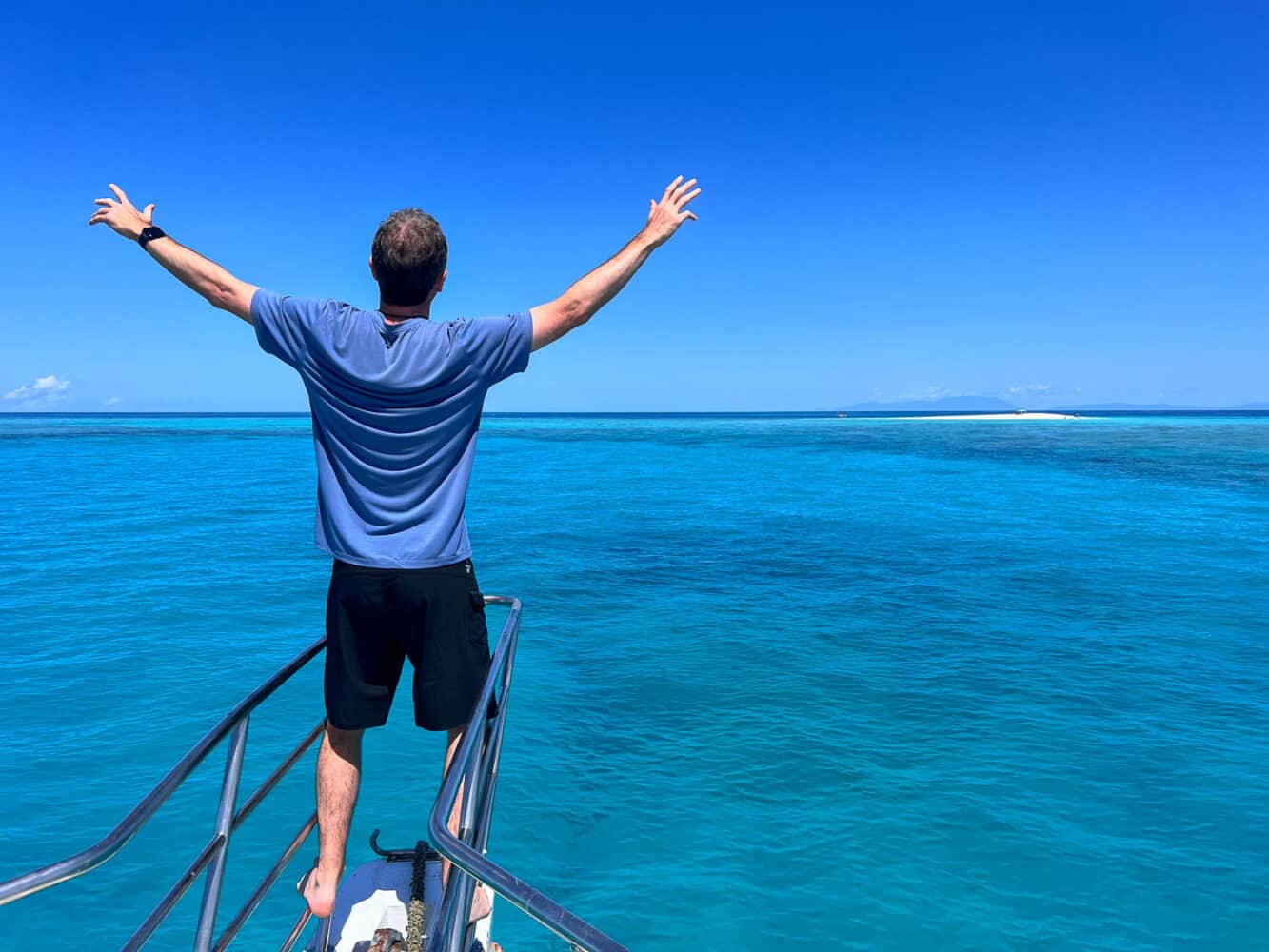 Simon on a boat at Beaver Cay, Mission Beach, North Queensland, Australia