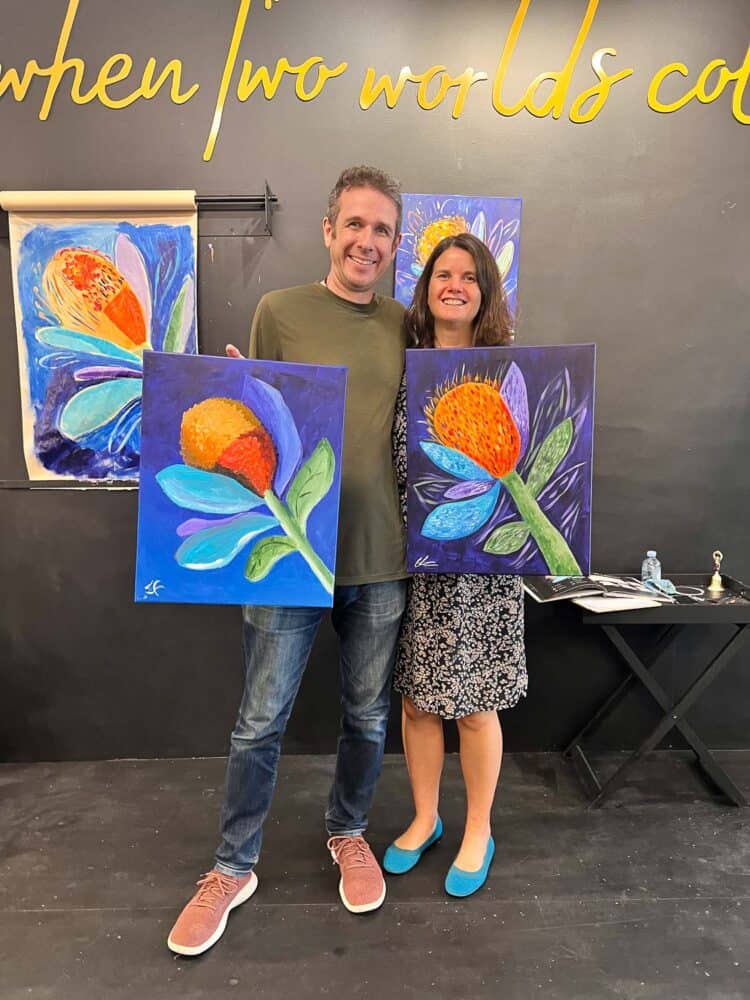 Simon and Erin with their paintings at Frida's Sip and Paint, Noosa, Queensland, Australia