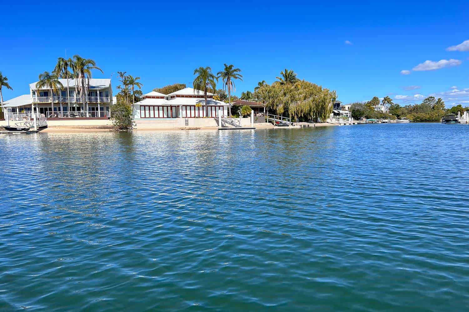 View of the Noosa River shore from a boat, Noosa, Queensland, Australia