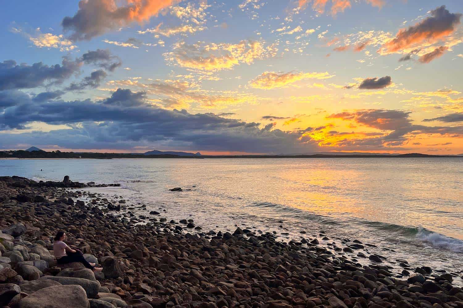 Sunset over rocky beach in Noosa National Park, Noosa, Queensland, Australia