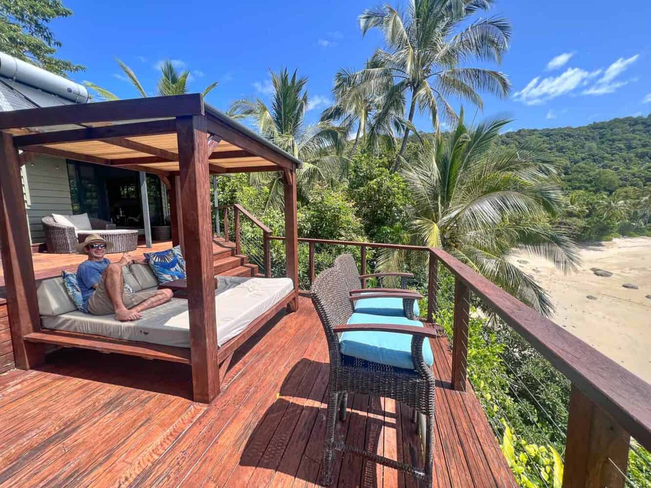Simon relaxing in the day bed on the deck, Treehouse Villa, Bedarra Island Resort, Queensland, Australia