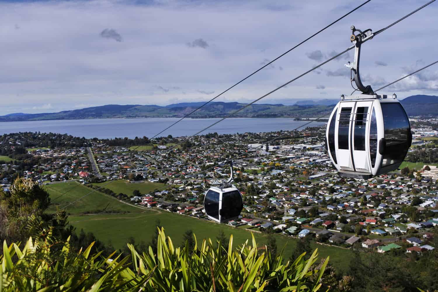 Cable cars above Rotorua lake and city, in the centre of North Island of New Zealand