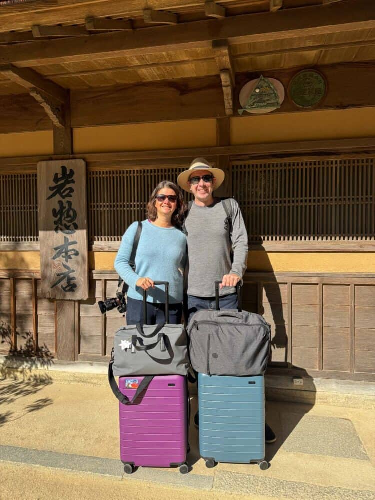 Erin and Simon with their Away bigger carry on suitcases in Japan