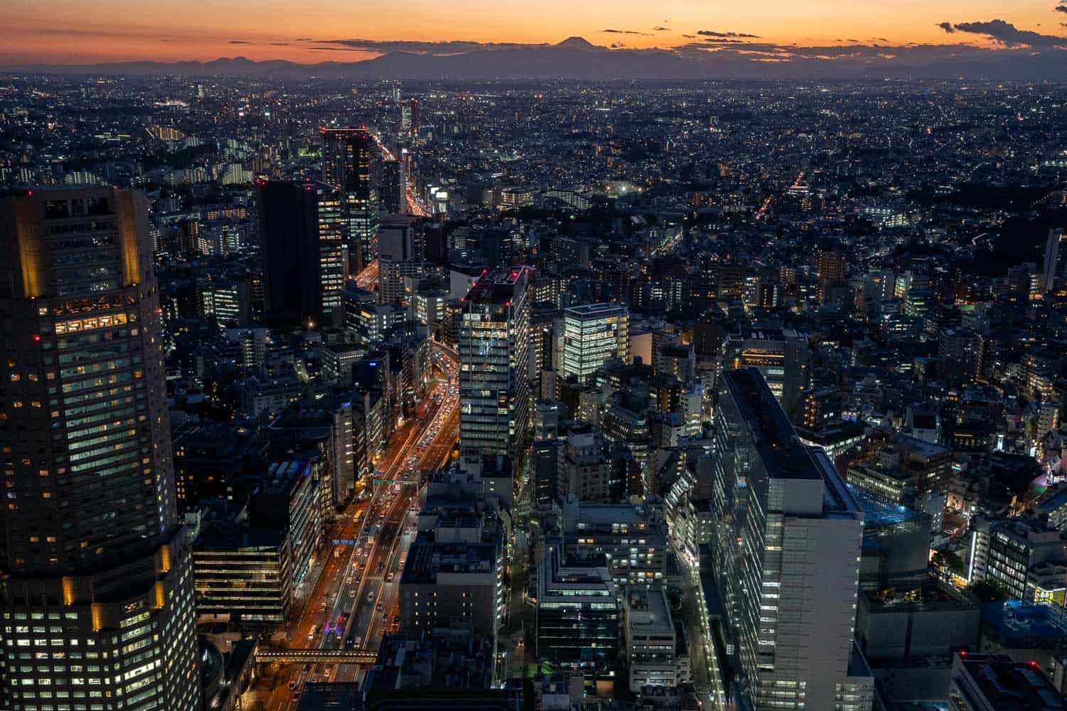 Shibuya Sky view at night with Mt Fuji silhouette