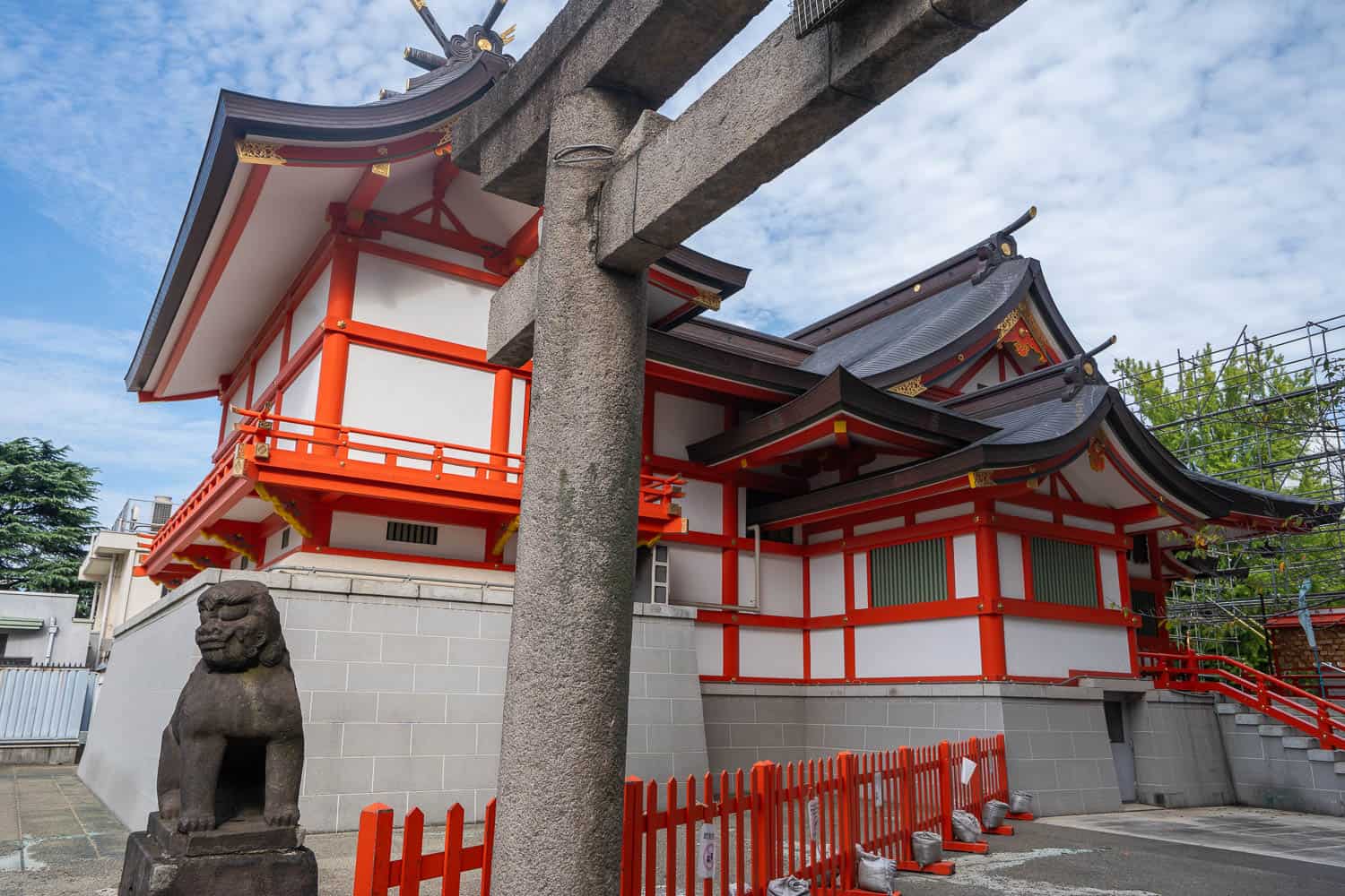 The torii gate and red main building of Hanazono Shrine in Shinjuku, Tokyo