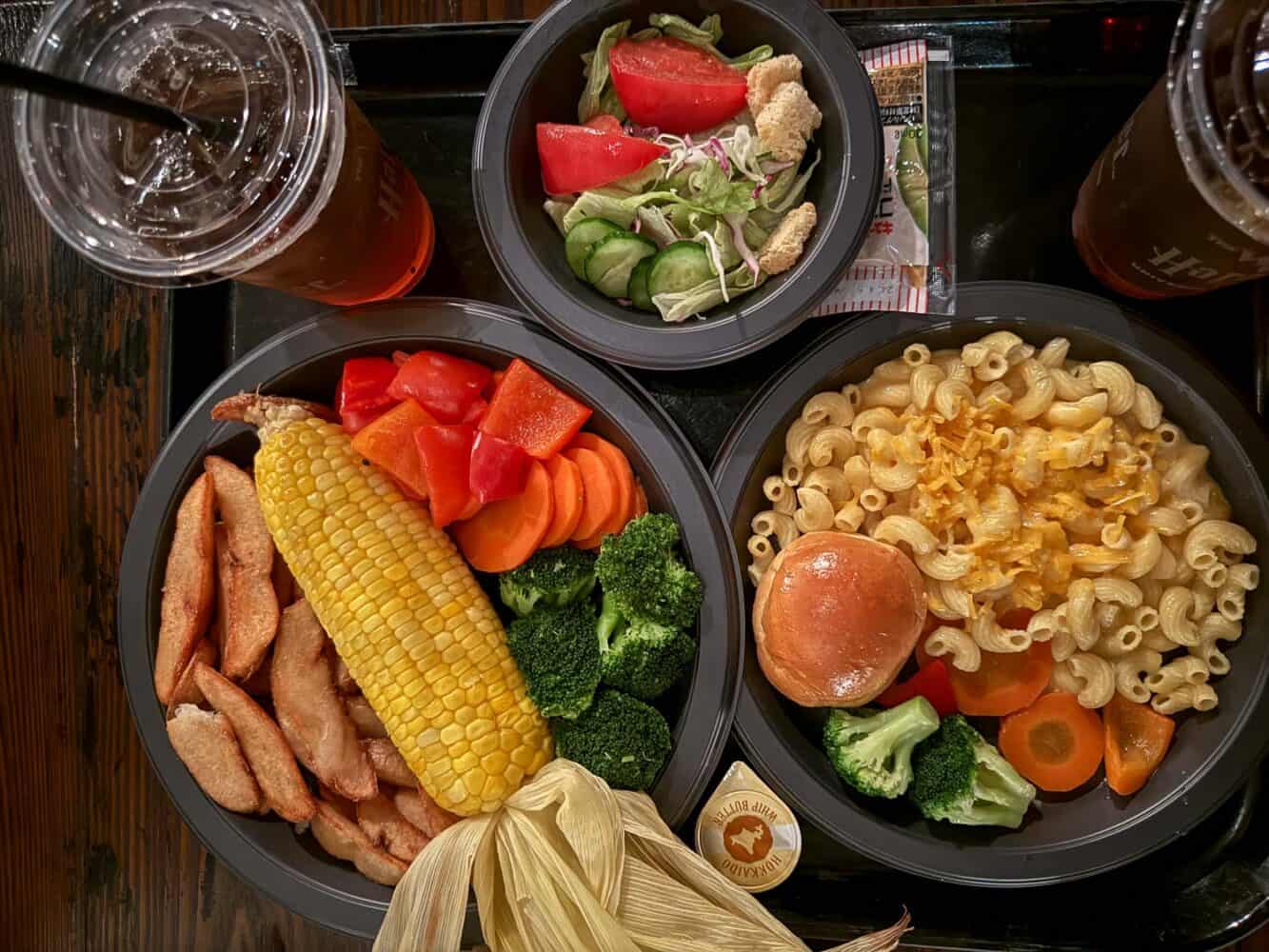 Vegetarian plate and kids macaroni and cheese at Three Broomsticks restaurant in Universal Studios Japan