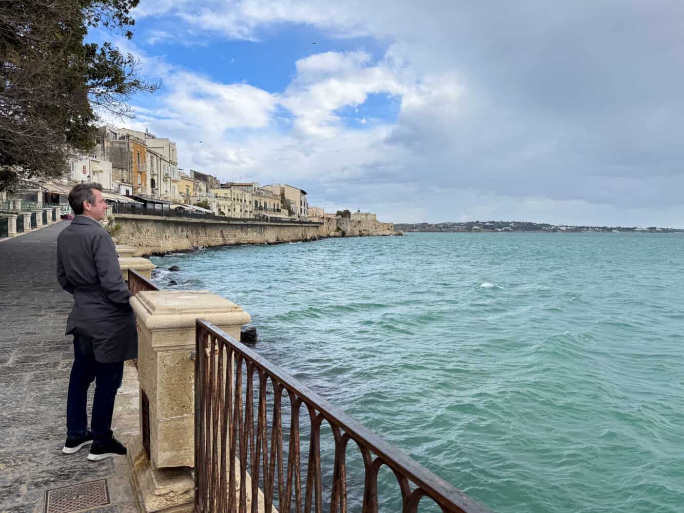 Simon looking over the sea at Lungomare Alfeo, Syracuse, Sicily
