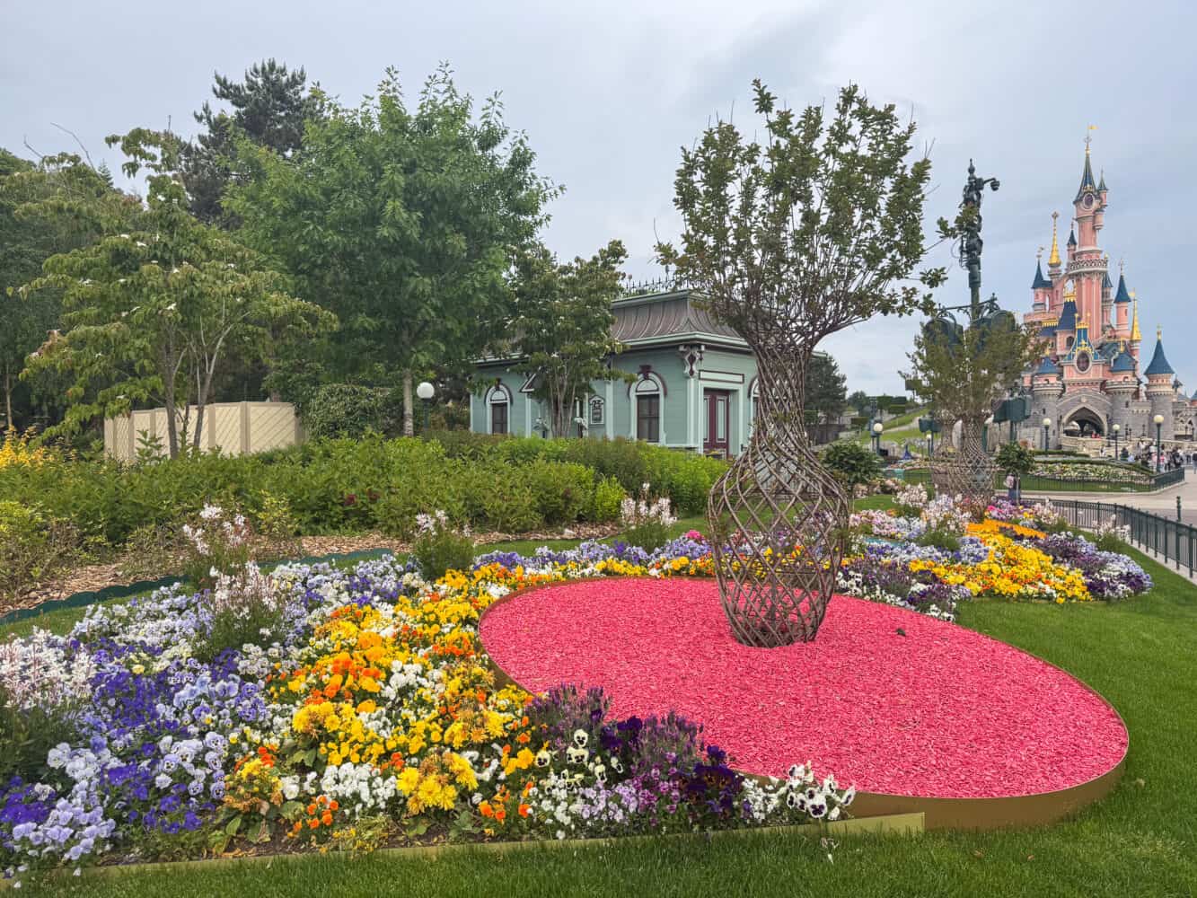 May flowers in Disneyland Park Paris with castle in the background