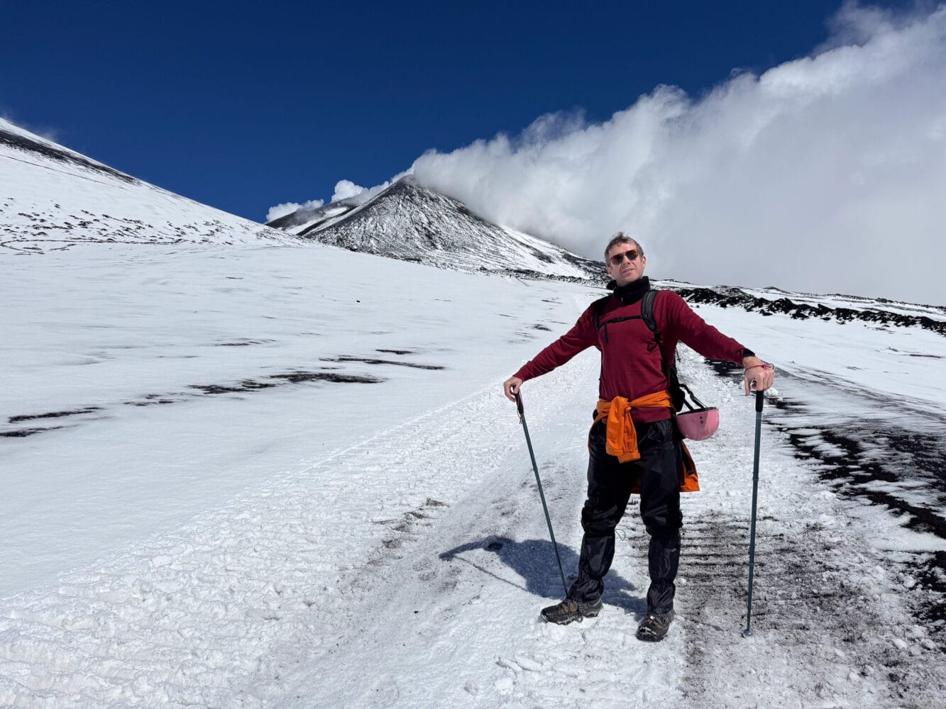 Simon walking up snowy Mount Etna, East Sicily, Italy