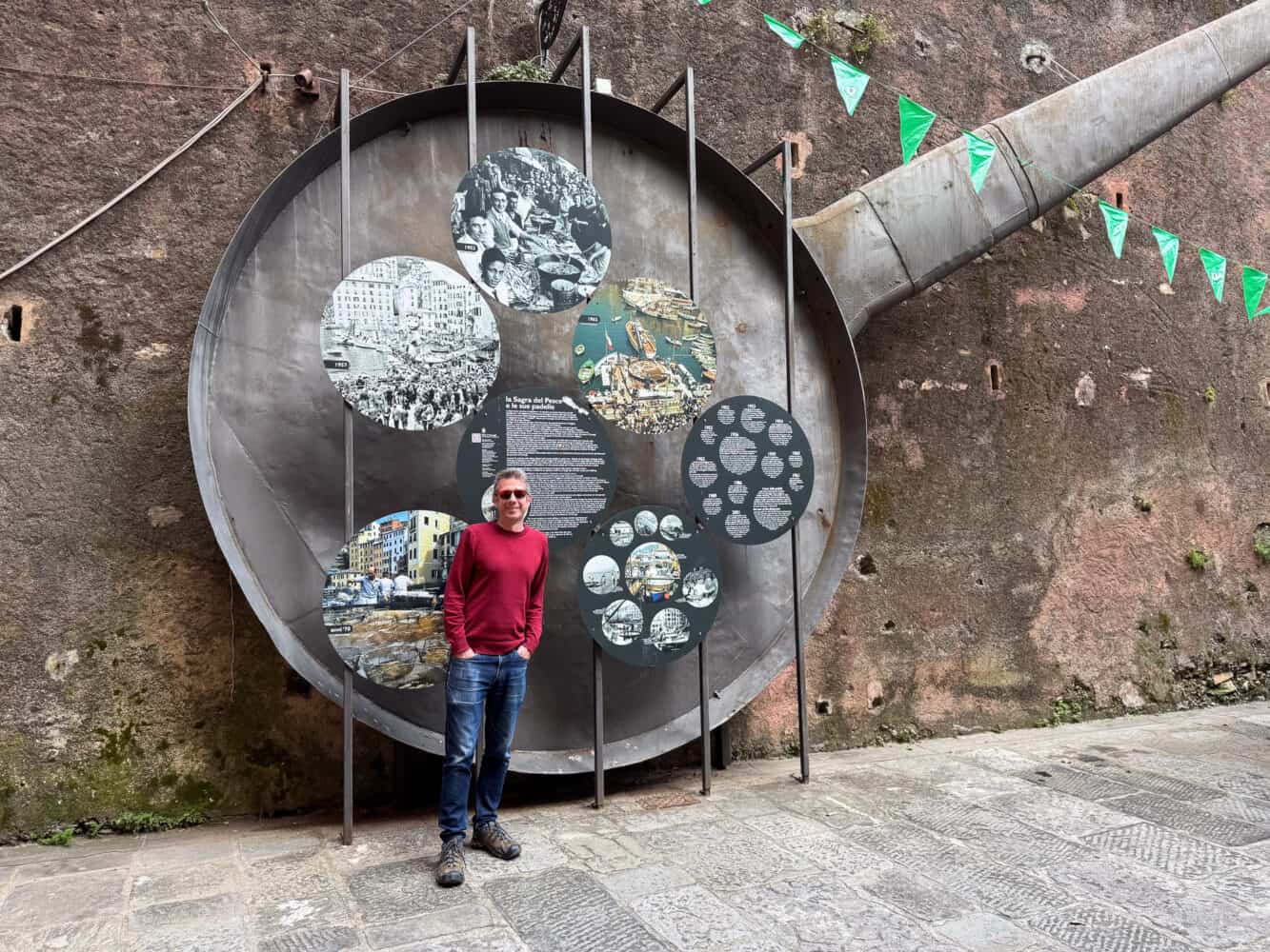 Simon standing next to the old giant Padella (frying pan) from the Camogli Fish Festival in Liguria, Italy
