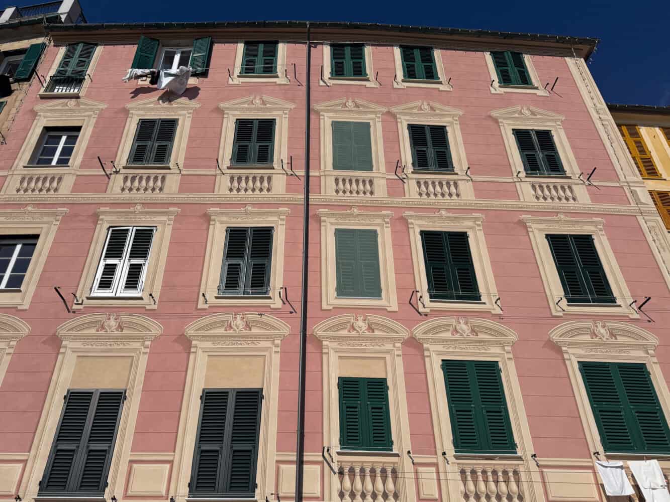 Pink house with trompe l'oeil details in Camogli, Italy.