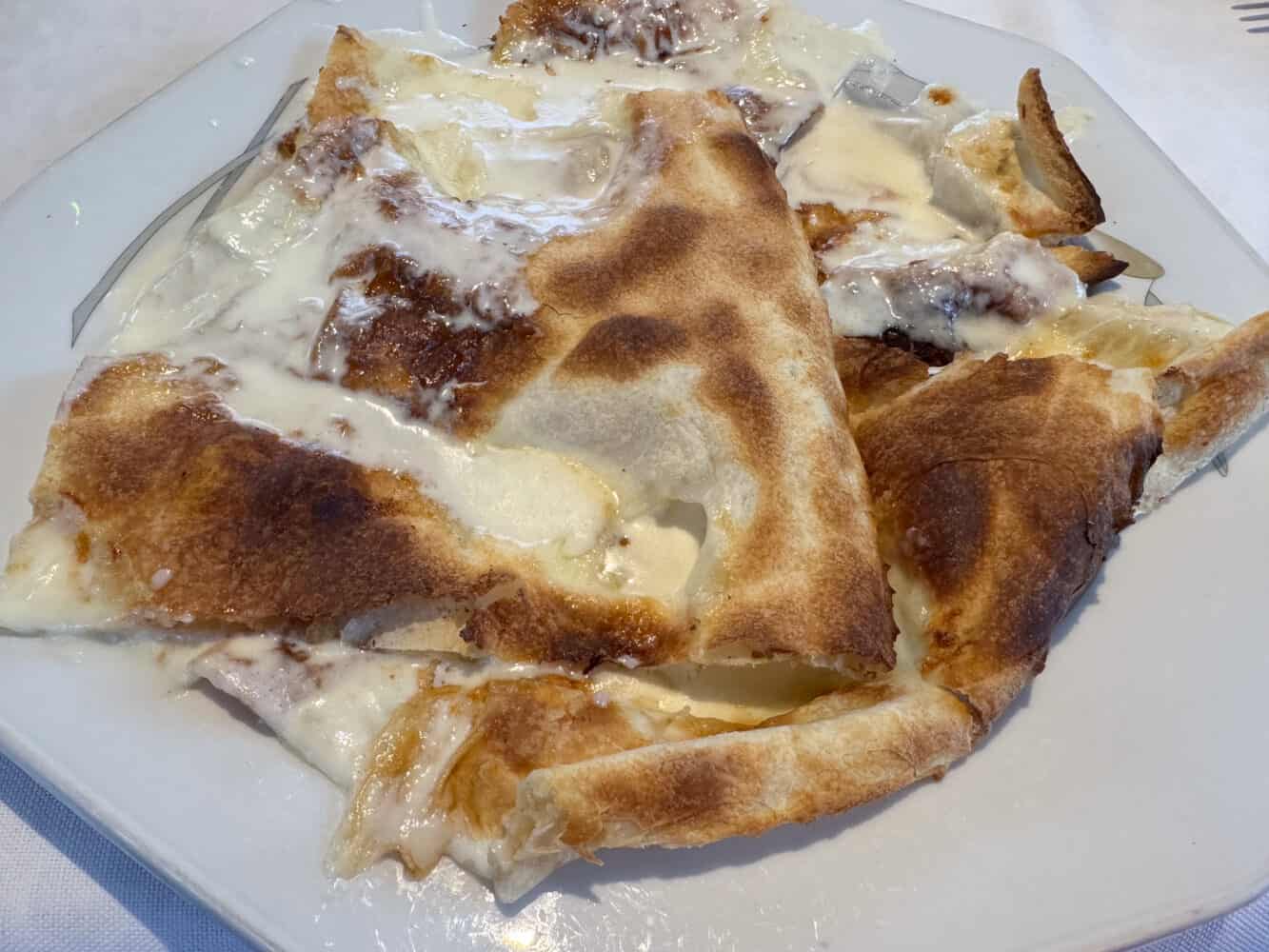 Focaccia di Recco at Ristorante Da O Vittorio Recco in Italy.