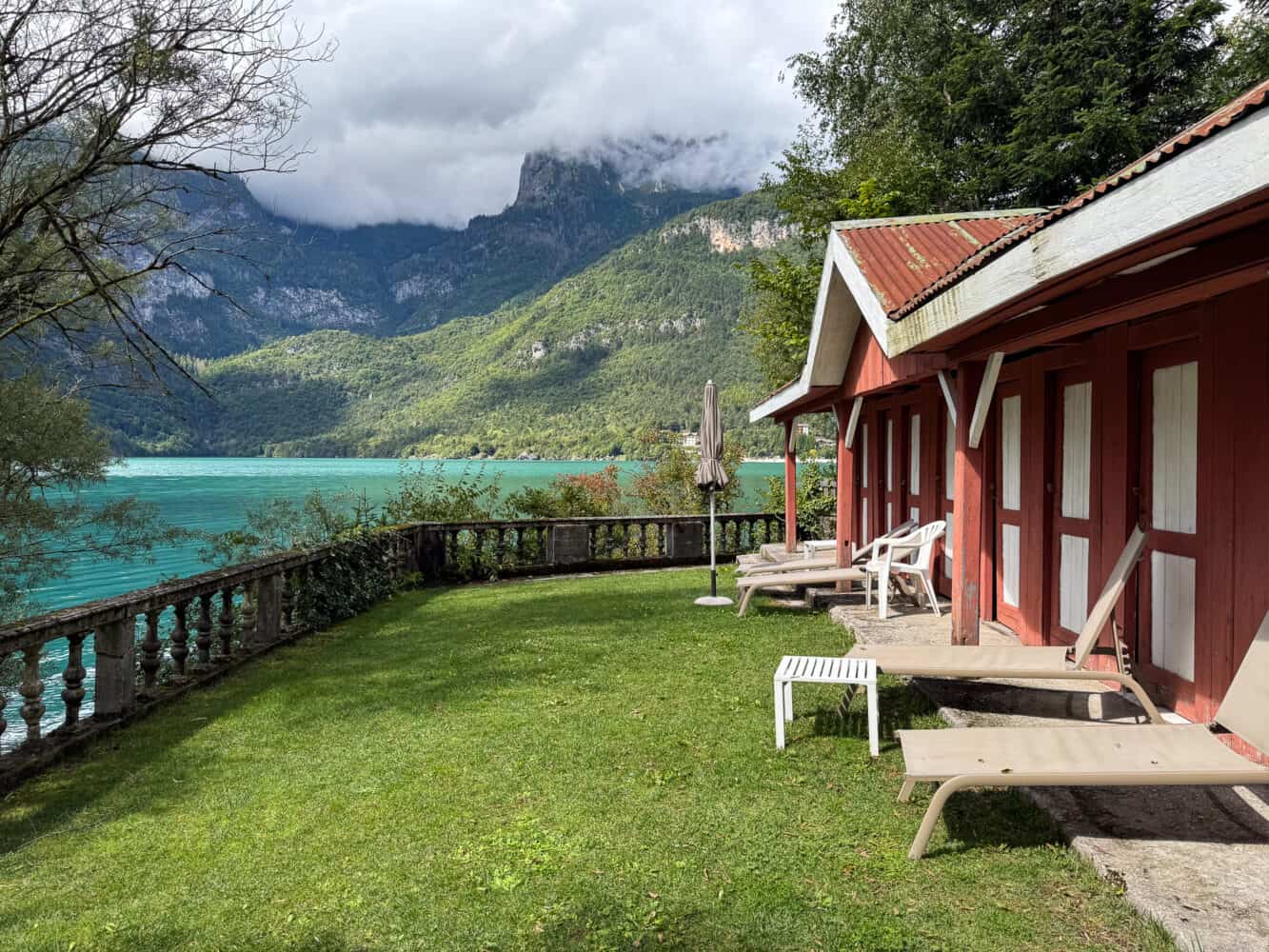 Sun loungers by the lake at Grand Hotel Molveno in Molveno, Italy
