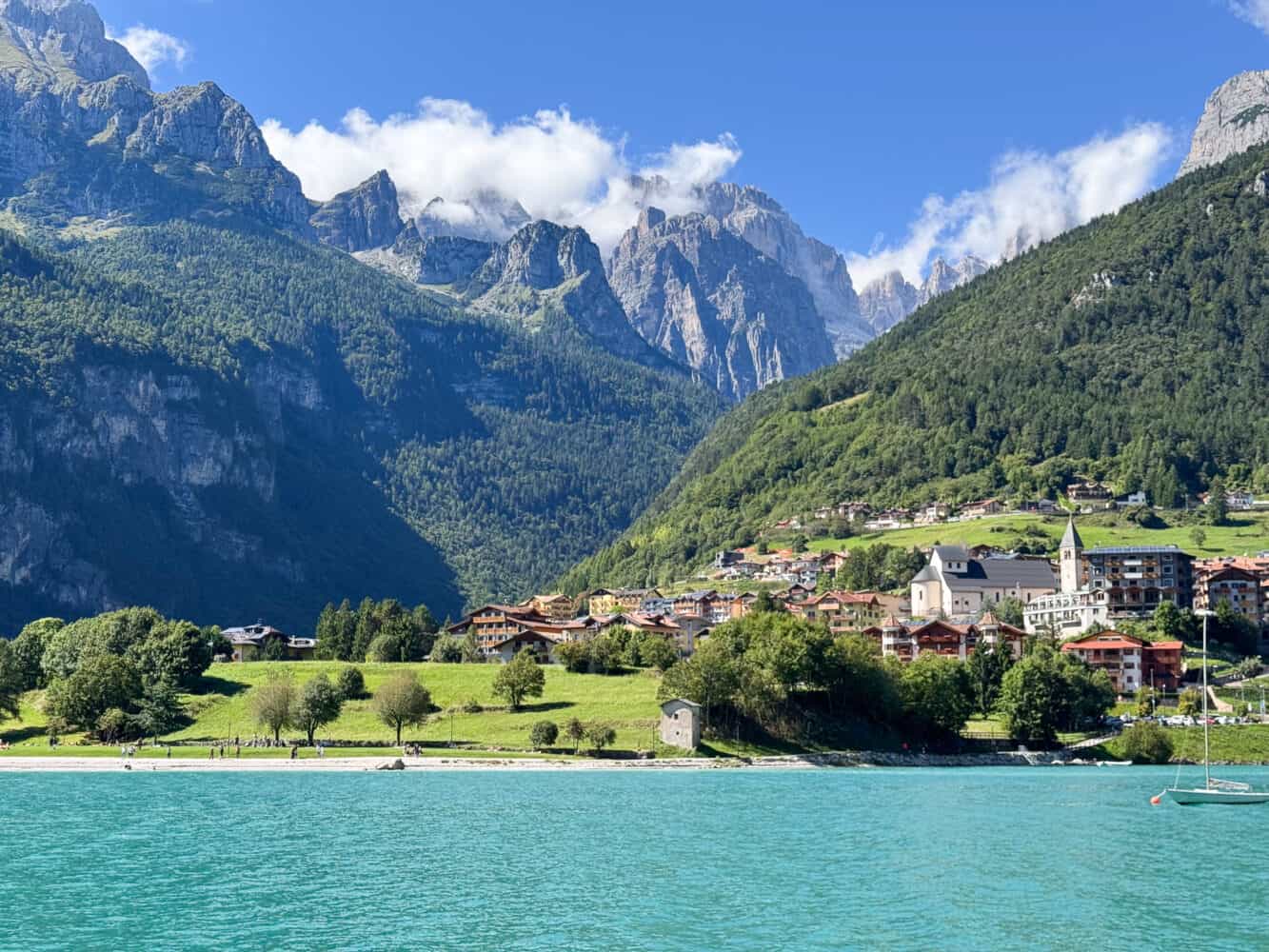 Molveno village with Lake Molveno in the foreground and the Brenta Dolomites behind.