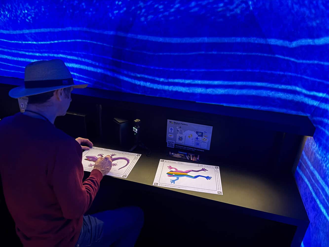Colouring in at Graffiti Nature at TeamLab Biovortex Kyoto.