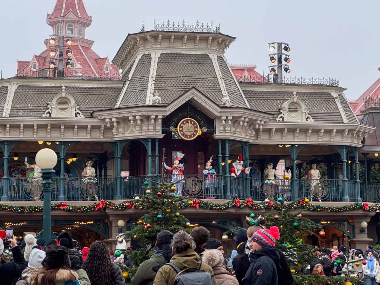 Mickey and Minnie and Santa in the Holiday Gathering at Disneyland Paris Enchanted Christmas.