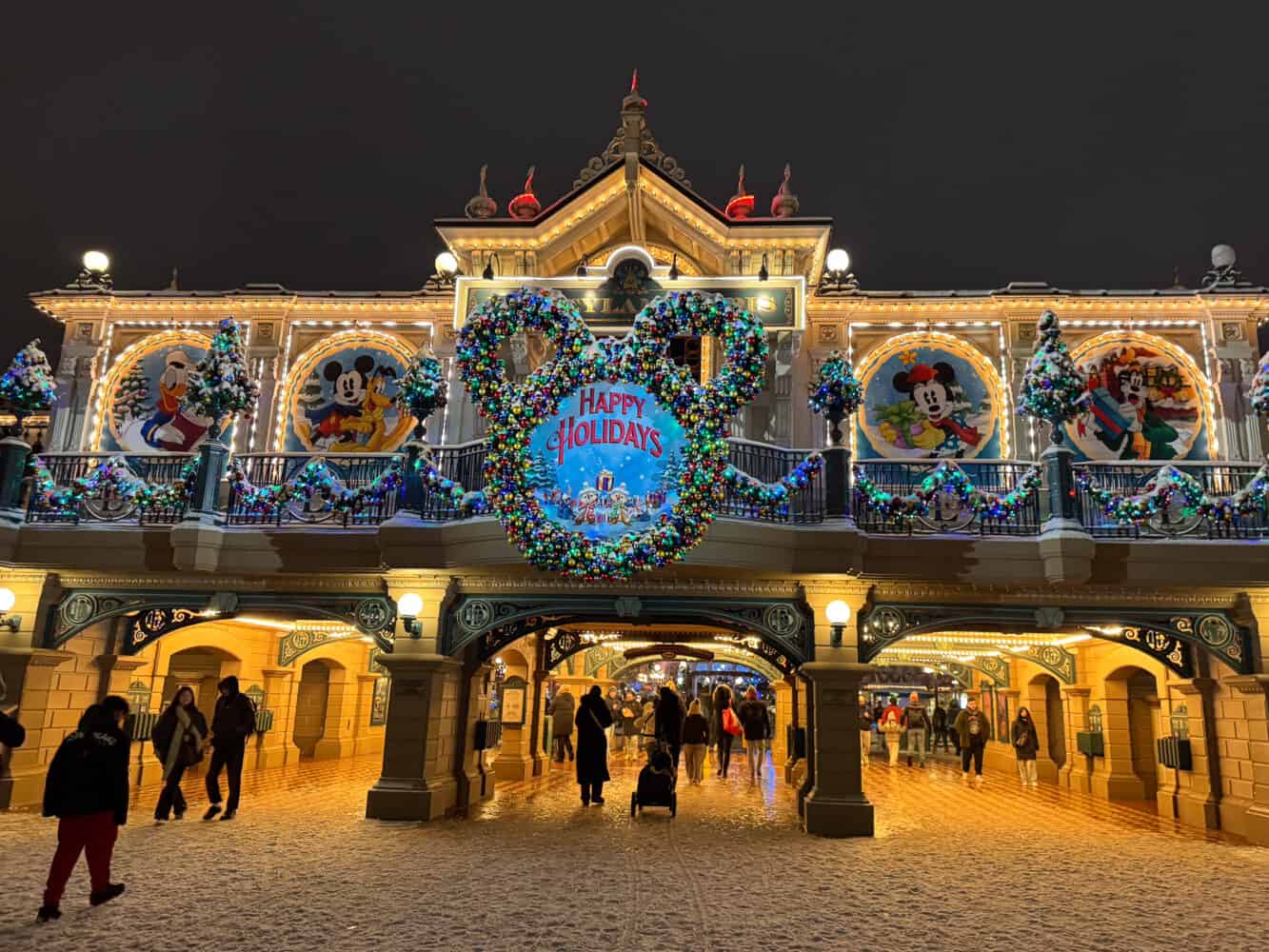 Happy Holidays sign at the entrance to Disneyland Paris at Christmas.
