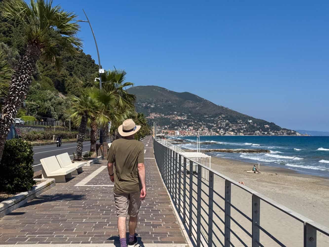 Walking the seafront promenade from Laigueglia to Alassio in Liguria, Italy.