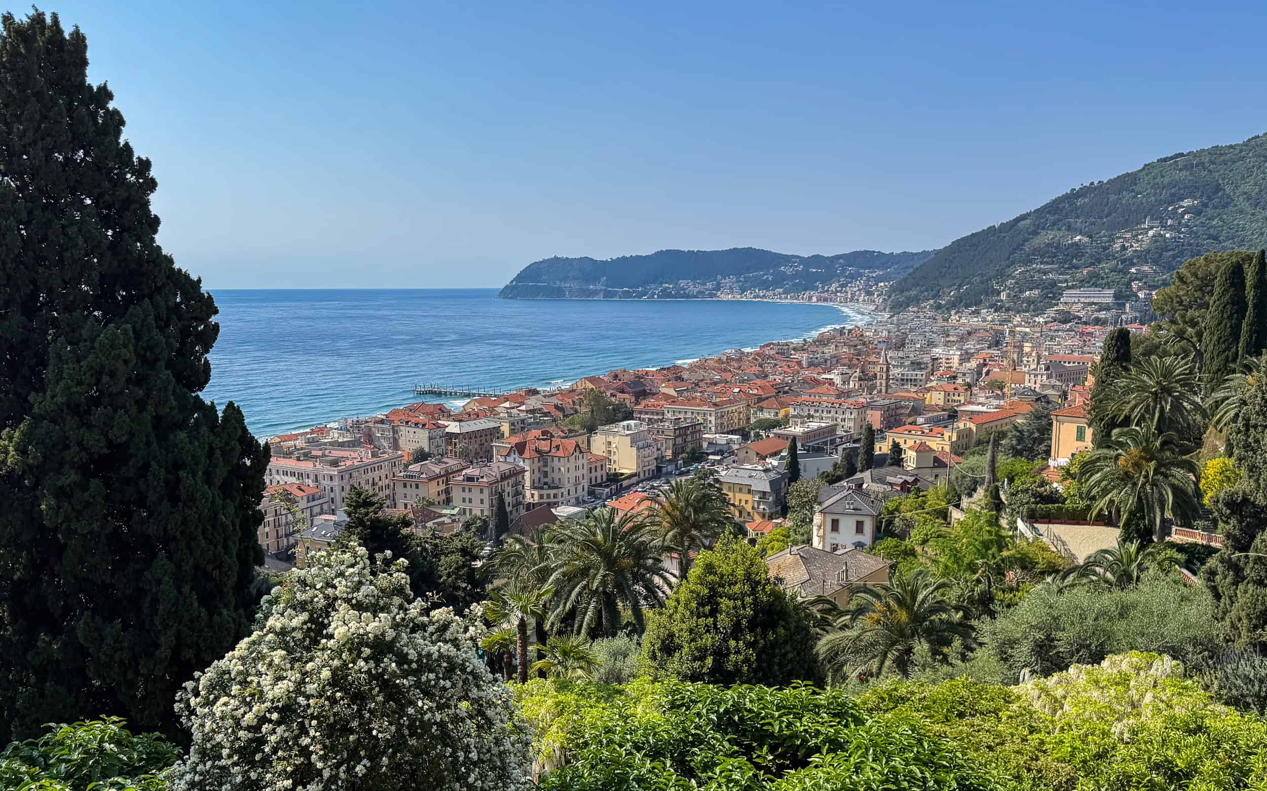 View of the town of Alassio, Italy with wisteria and the sea taken from Villa della Pergola.